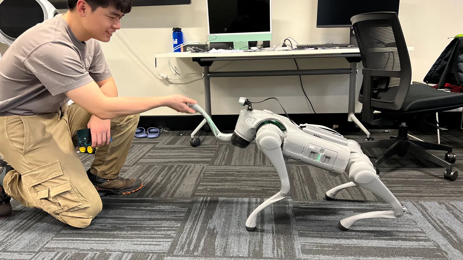A quadruped robot interacting with a researcher